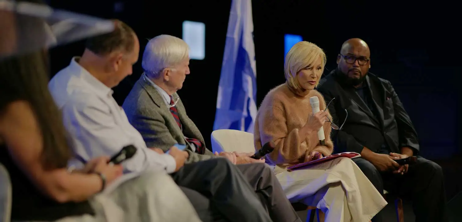 Pastor Paula White-Cain speaking in front of NFAB advisory members.