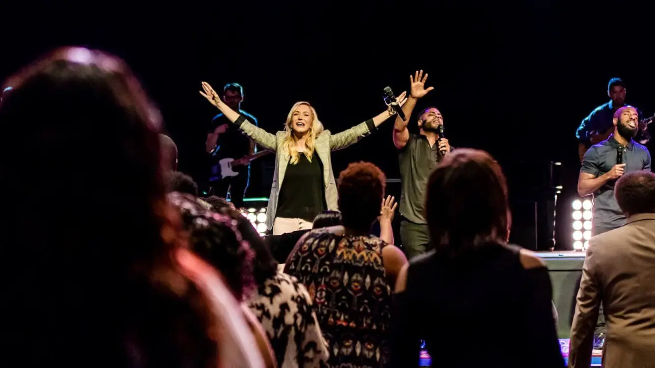 Paula White worshipping during Paula White Ministries service