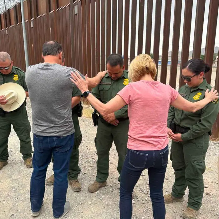 Paula White praying with others at Operation Border Blessing