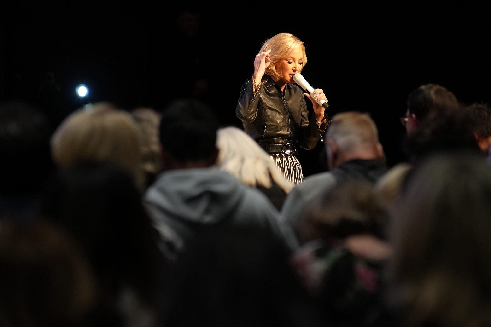 Paula White ministering during a service